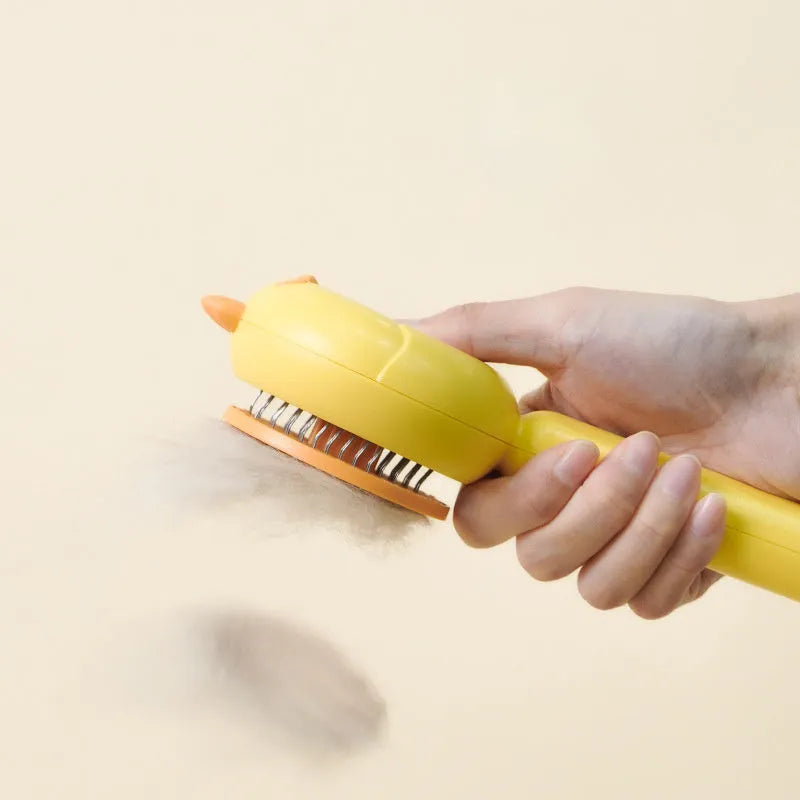 Purple pet grooming brush with stainless steel bristles and self-cleaning button