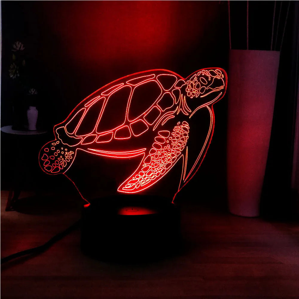 Turtle-shaped acrylic night light with multi-coloured 3D LED glow, showing remote control.
