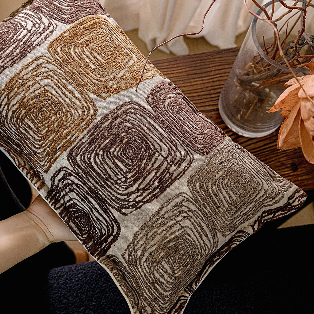 Cream and coffee-coloured abstract coil pattern pillow cover shown in square and rectangular sizes