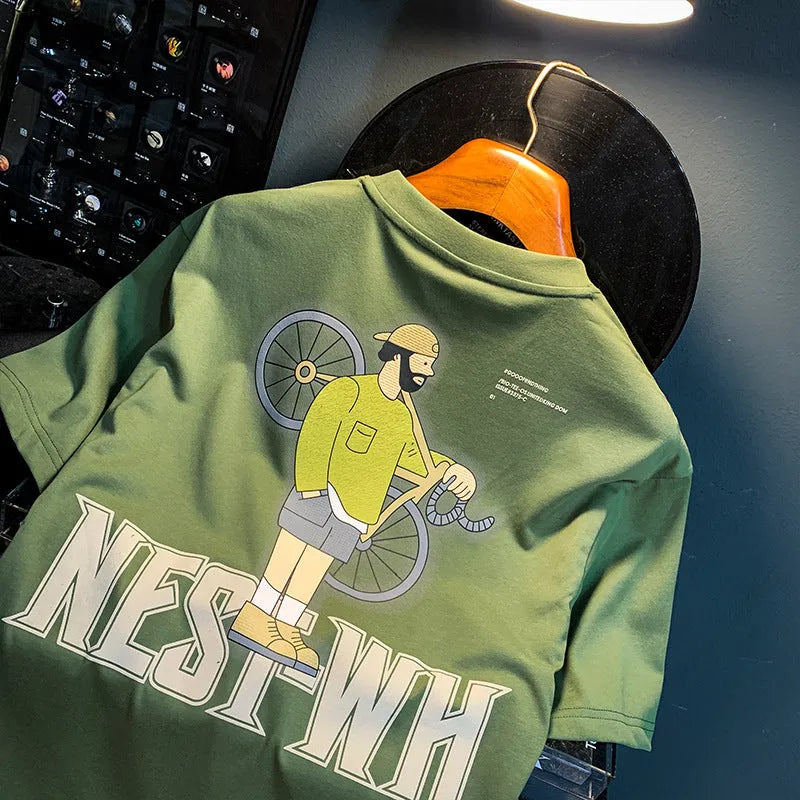 Green loose-fit men's t-shirt with a printed design on the front, featuring short sleeves.