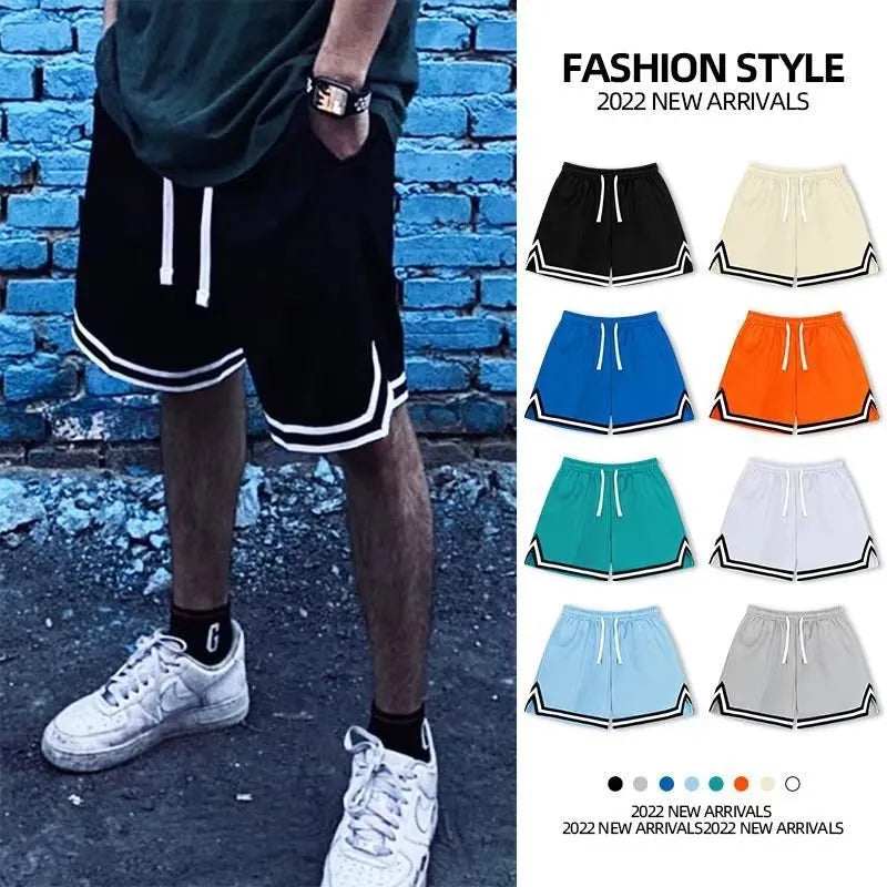 Men's loose-fit polyester sports shorts in various colours with elastic waistband