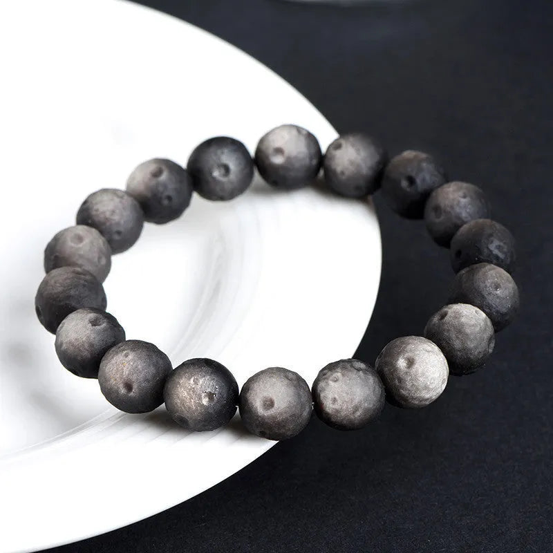 Obsidian crater ball bracelet with grinding texture in silver or gold meteorite finish