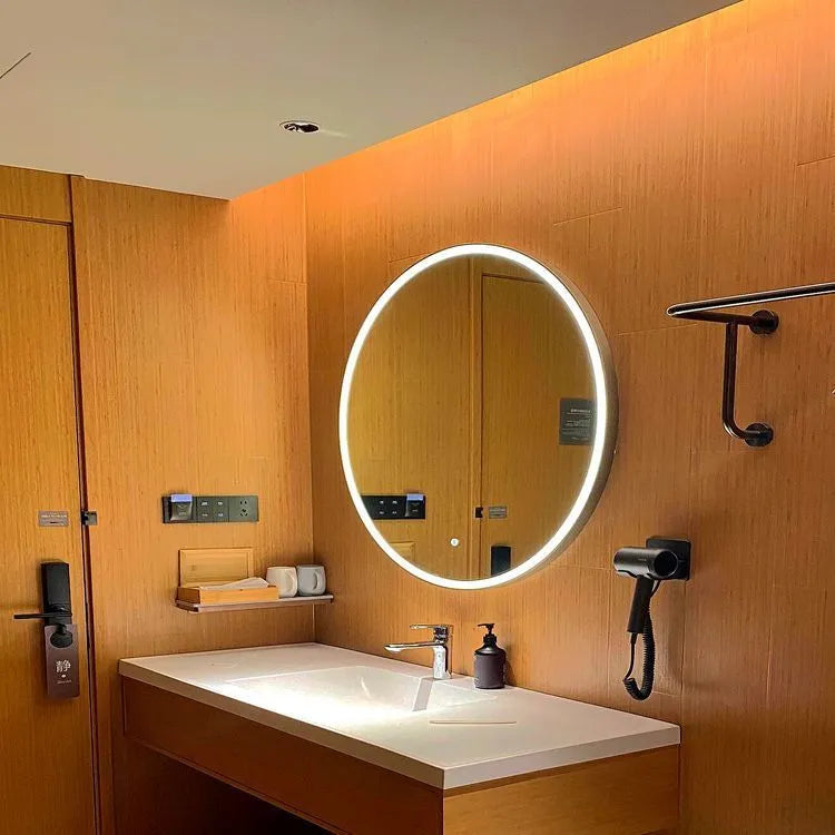 Round black framed wall-mounted LED smart bathroom mirror showing touch control and three light colours.