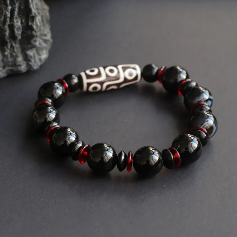 Black agate dzi bead bracelet with 11mm geometry beads and hand-woven construction