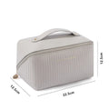 Cubic pillow-shaped PU makeup bag in a vertical pattern, shown in one of five colours: beige, black, brown, grey, or pink.