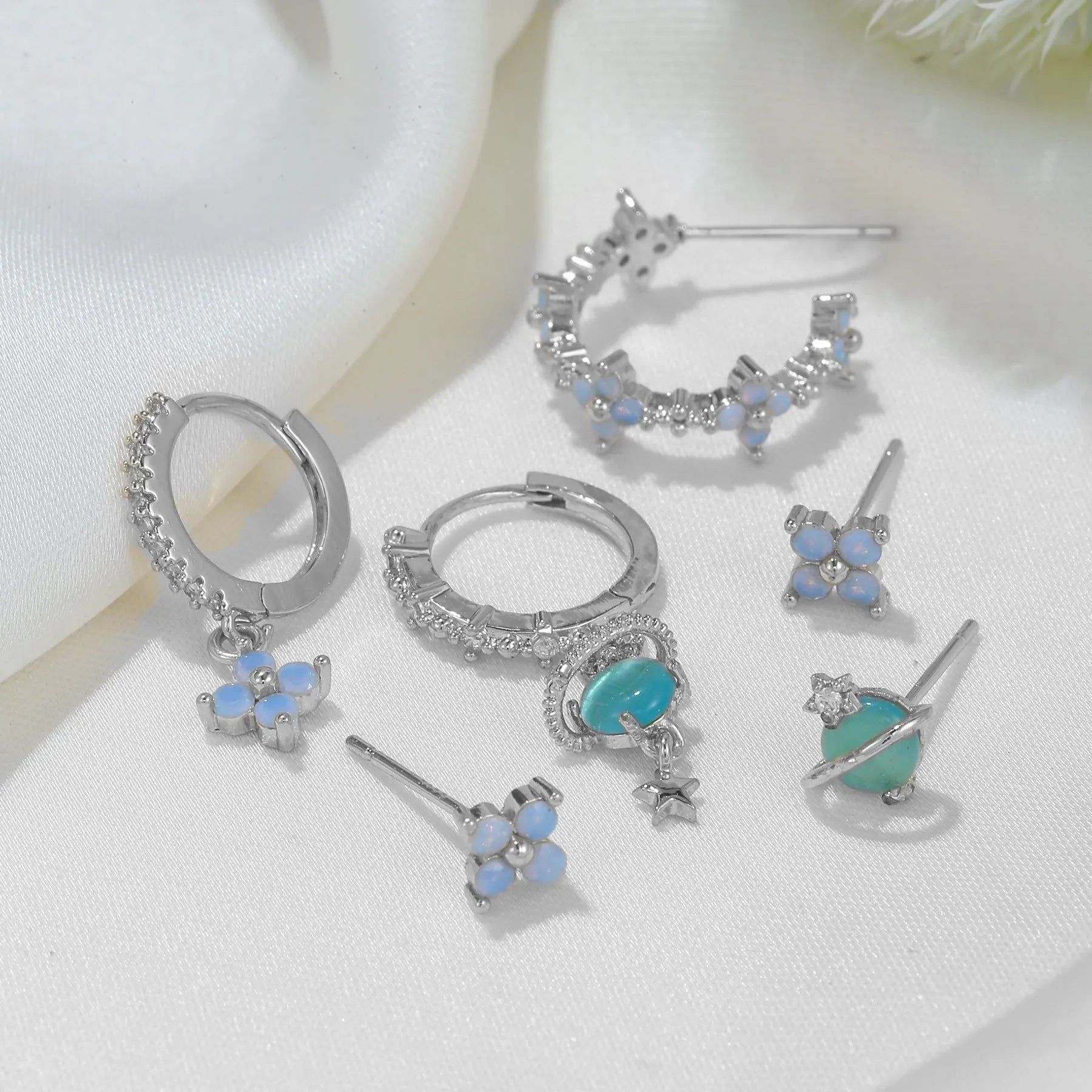 Flower design ear studs with zircon mosaic detail in gold and silver colours