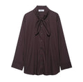 Brown loose-fit women's poplin shirt with long sleeves and a matching bow tie scarf, shown in a cardigan style.
