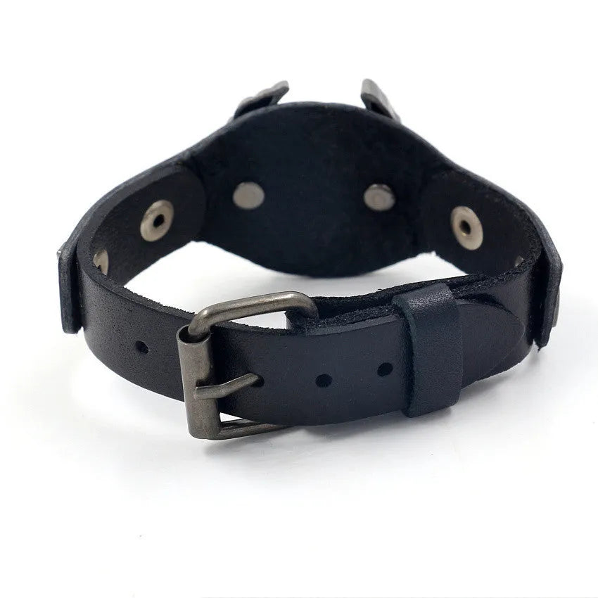 Black geometric leather bracelet with alloy eagle watch-buttom fastening showing tapered width design