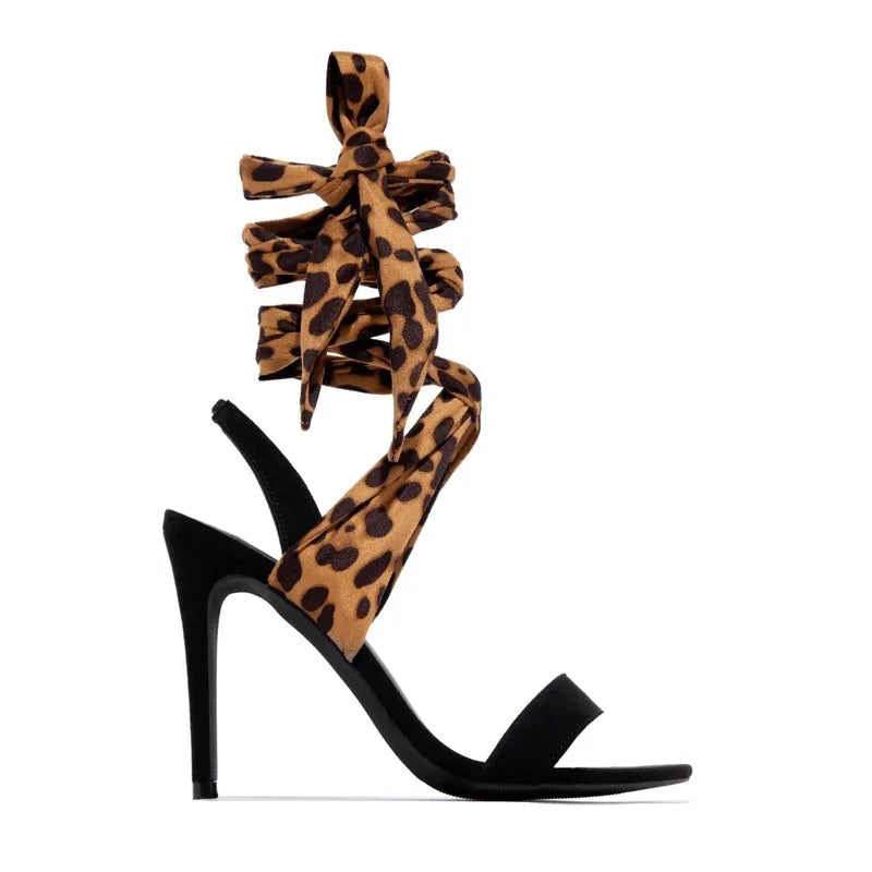 Light brown leopard print women's high heels with cross straps and a fine high heel