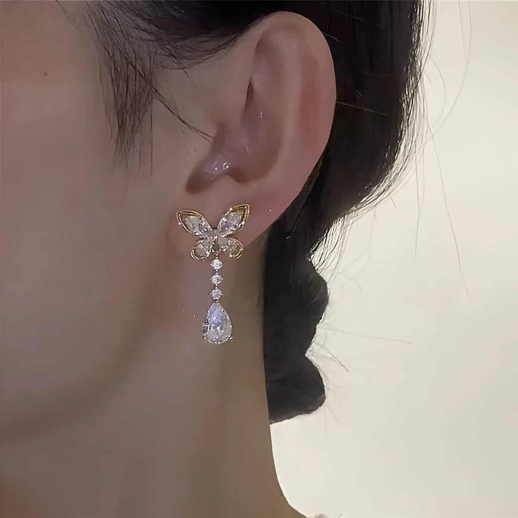 Bow-shaped stud earrings with platinum electroplated finish on zinc alloy for women's jewellery