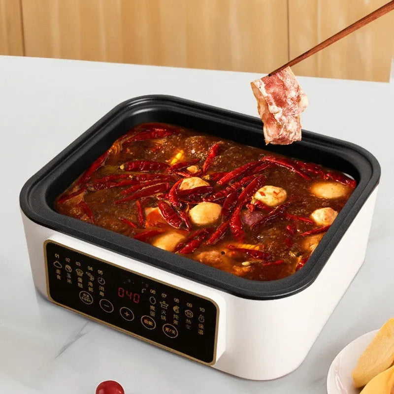 28-litre electric steamer with stainless steel rack showing control panel and compact kitchen design