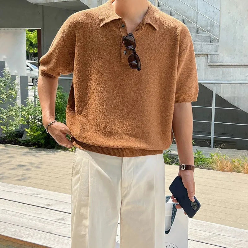 Man wearing a caramel-coloured retro knitted polo shirt with short sleeves and an asymmetric design detail.