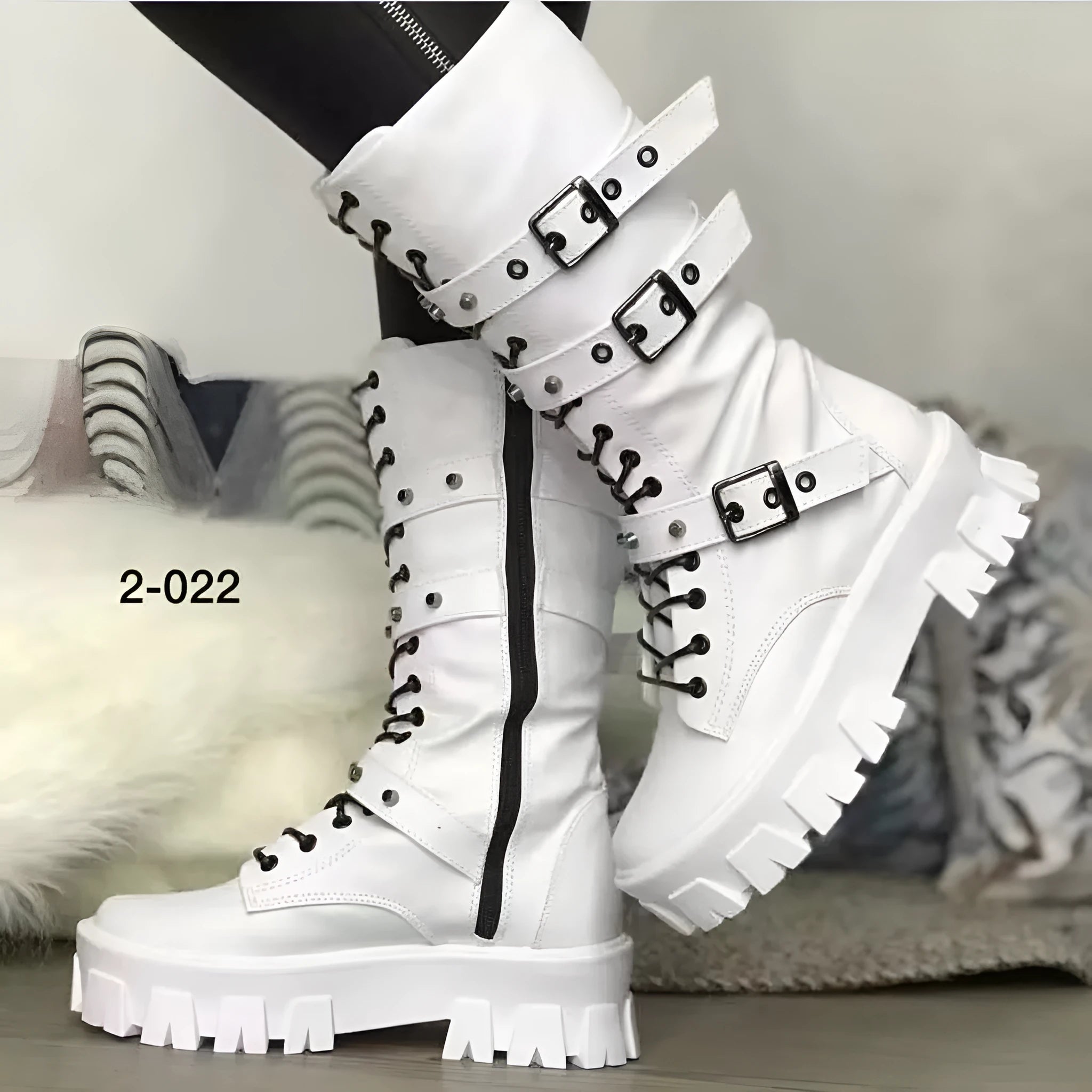 Women's black mid-calf knight boots featuring a metal buckle strap and a side zip closure.