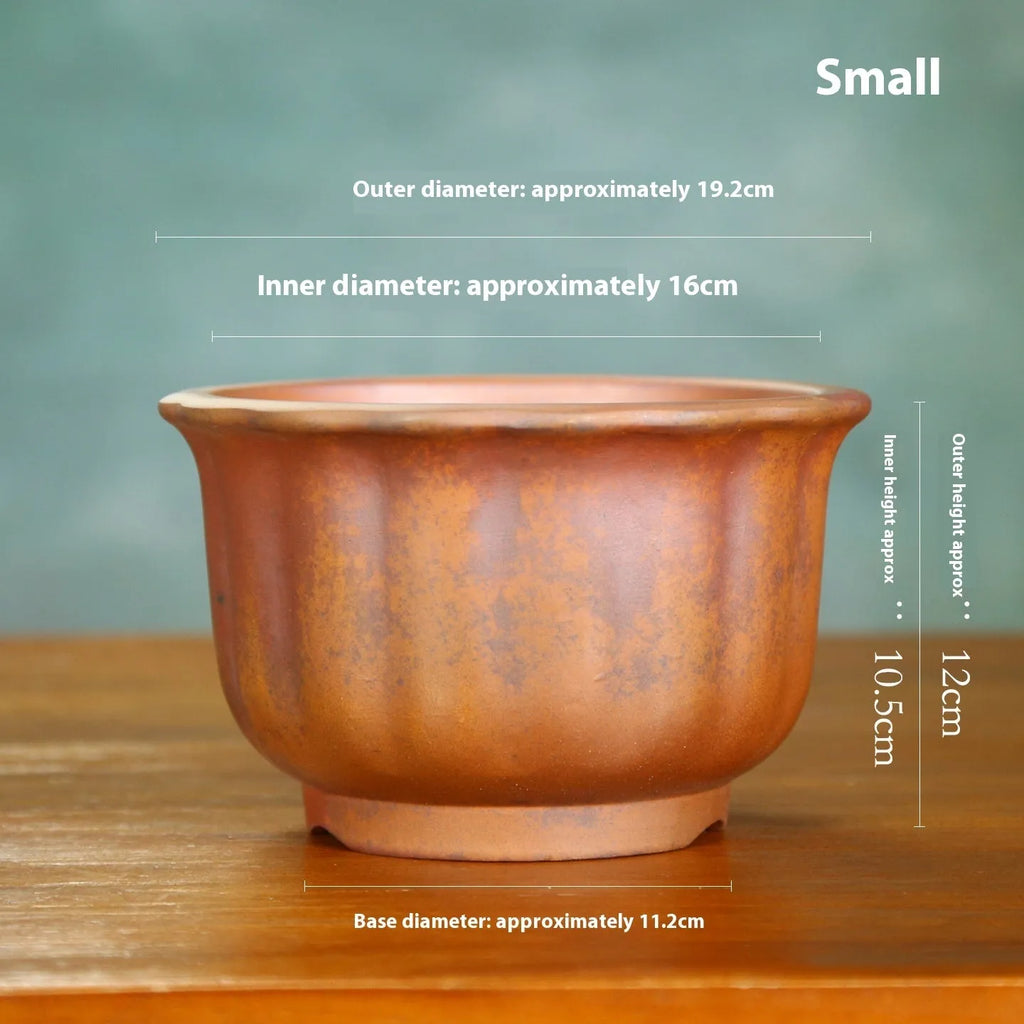 Antique carved ceramic flower pot with purple sand finish and wood burning texture