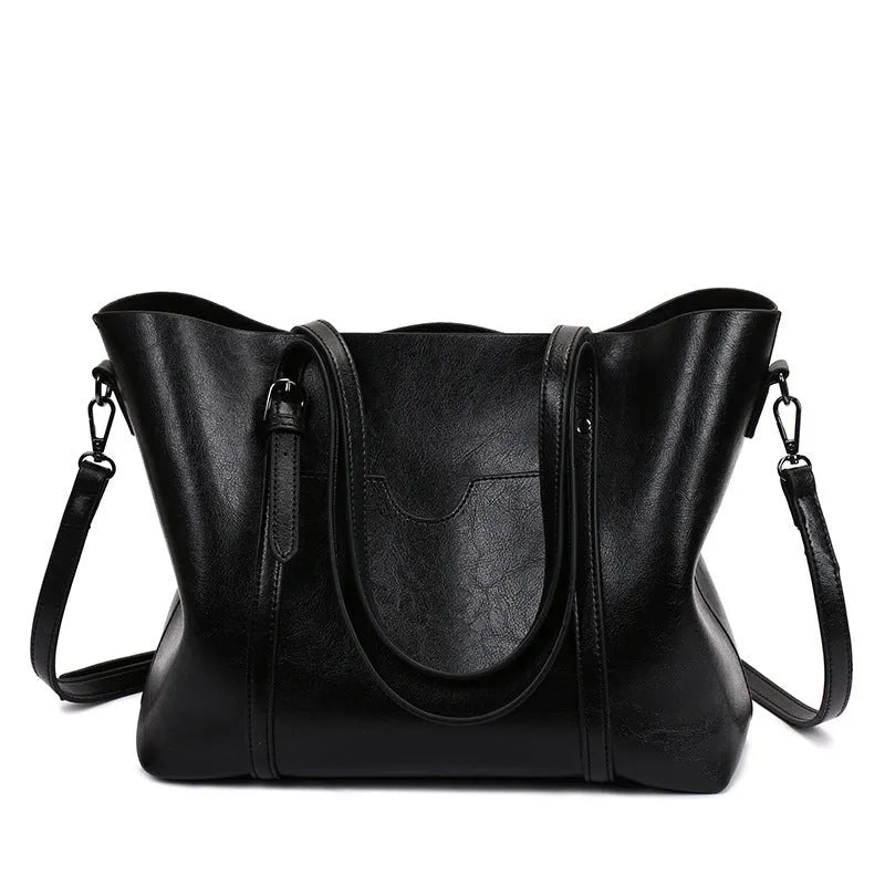 Retro-style women's messenger bag in PU leather, shown in a choice of colours with large main compartment.