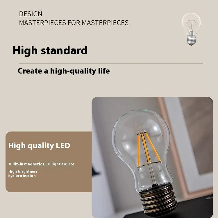 Iron art suspension bulb desktop night lamp on a square wooden base.