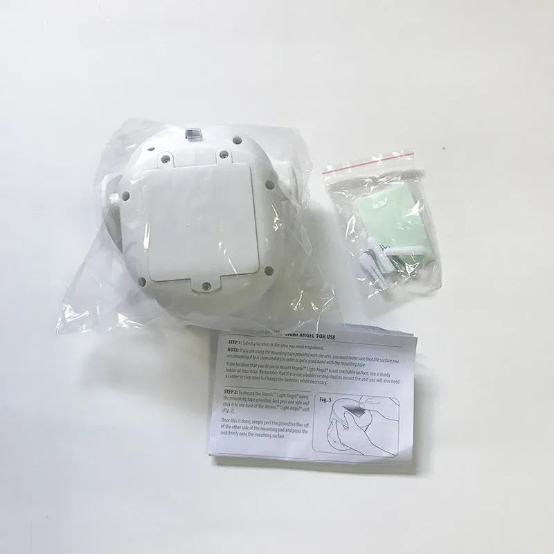 White Atomic Angel induction light unit showing compact design