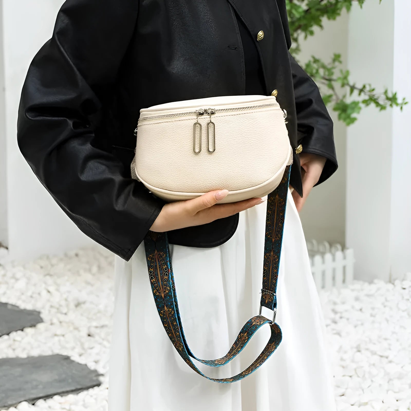 Women's soft PU leather messenger bag in saddle shape with single shoulder strap and sewing line details