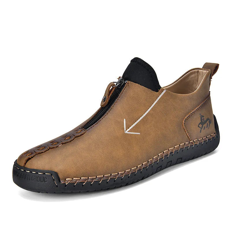Men's black martin boot with front zipper and round toe on a rubber sole.