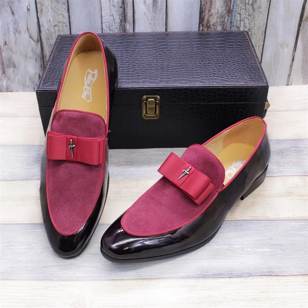 Men's glossy black patent leather low-top shoes with a tassel detail on a rubber sole.