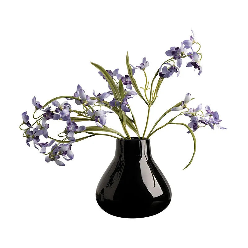 Ceramic decorative vase with artificial orchid flowers in black or white colour options