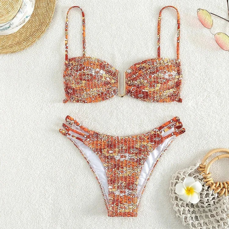 Women's high-waisted floral bikini swimsuit in blue, orange, pink, or rose red on a mannequin