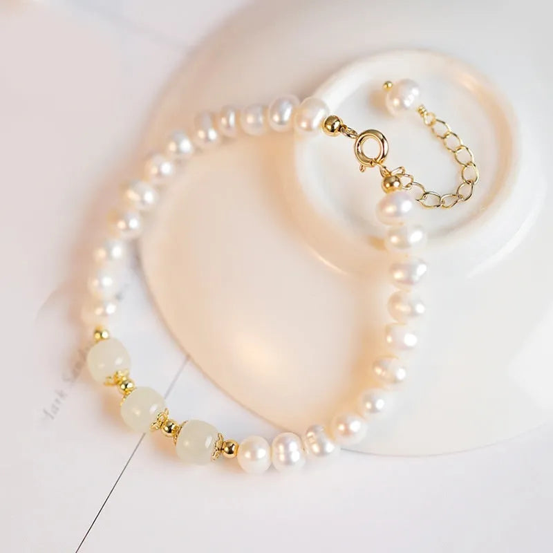A diamond-shaped natural freshwater pearl bracelet in a Korean style, shown in deep Hetian jade colour with an electroplated finish.