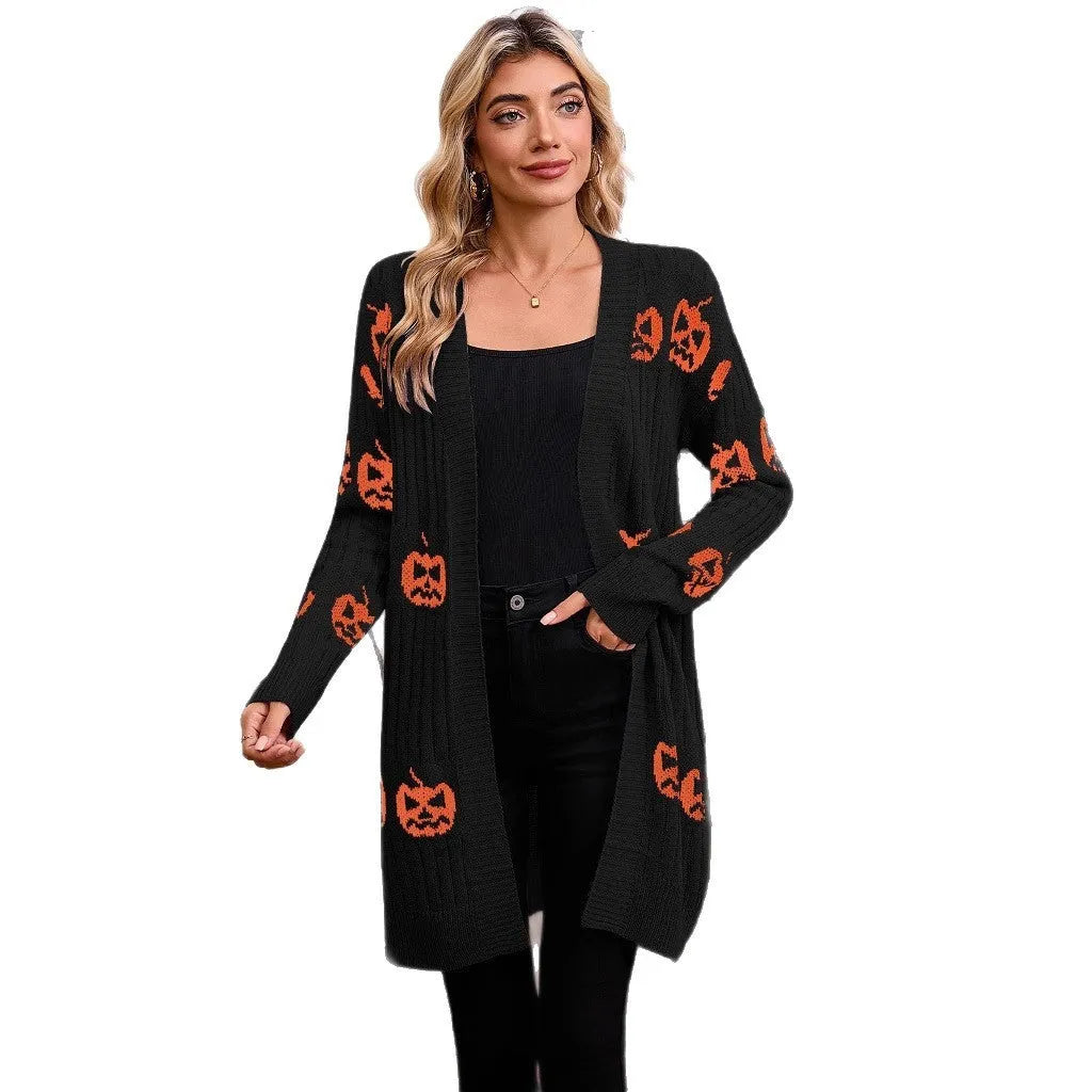 Women's black Halloween cardigan with orange pumpkin head jacquard pattern, shown as a straight-cut medium-length knit.