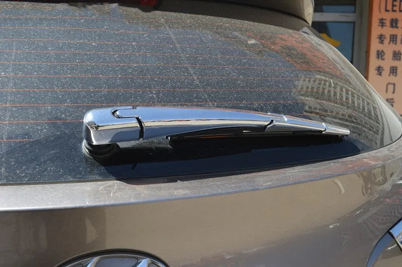 Set of four silvery ABS plastic rear wiper arm cover trims for 2010 Hyundai models.