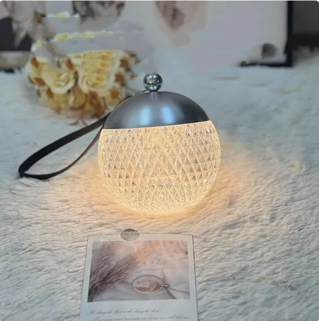 Portable dimmable touch lamp in modern minimalist design with chrome finish