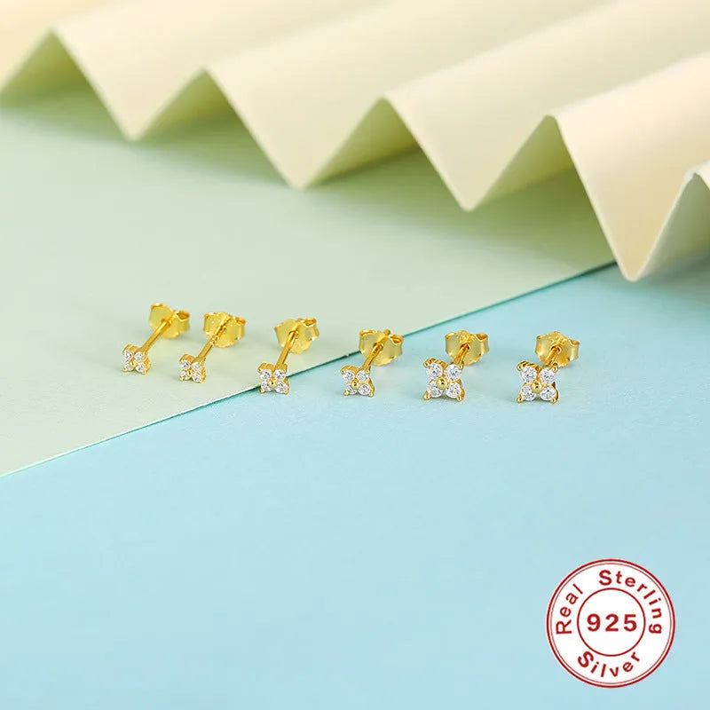 S925 sterling silver petal crystal flower stud earrings in gold finish on a white background.