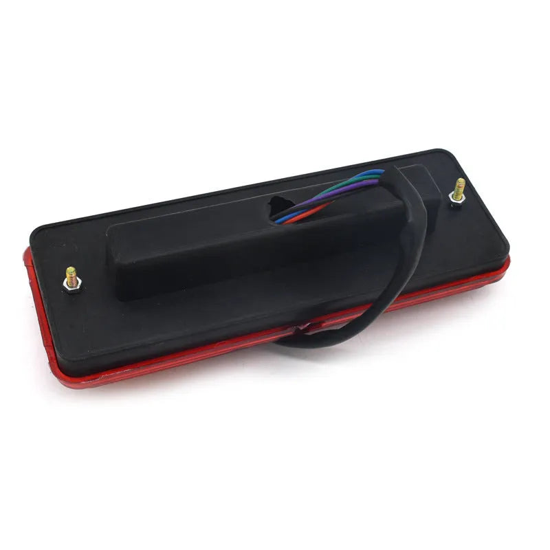 Black semi-closed taillight for an electric tricycle, showing its integrated shell design.