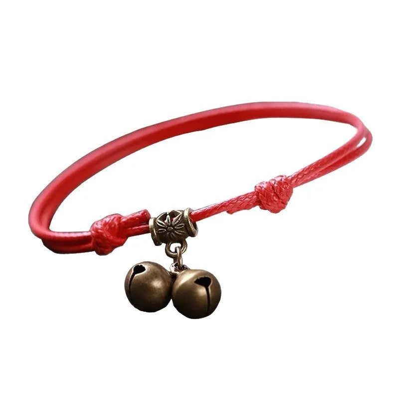 Adjustable nylon rope dog collar with brass bell shown in black, red, and coffee colours.