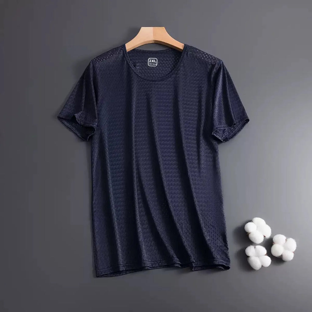 Man wearing a loose-fitting grey ice silk short sleeve crew neck T-shirt.