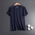 Man wearing a loose-fitting grey ice silk short sleeve crew neck T-shirt.