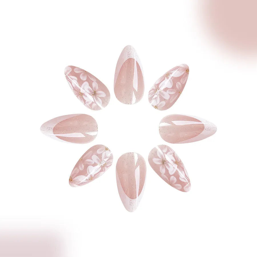 Short almond press on nails with French tip, flower pattern and glitter powder in C625 style