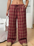 Women's plaid trousers with drawstring waist and front pockets in red colour