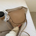 Retro woven PU leather crossbody bucket bag in khaki colour showing bucket shape and shoulder strap
