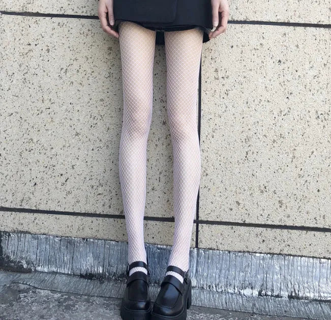 Women's black and white mesh stockings in large, medium, and small net patterns.