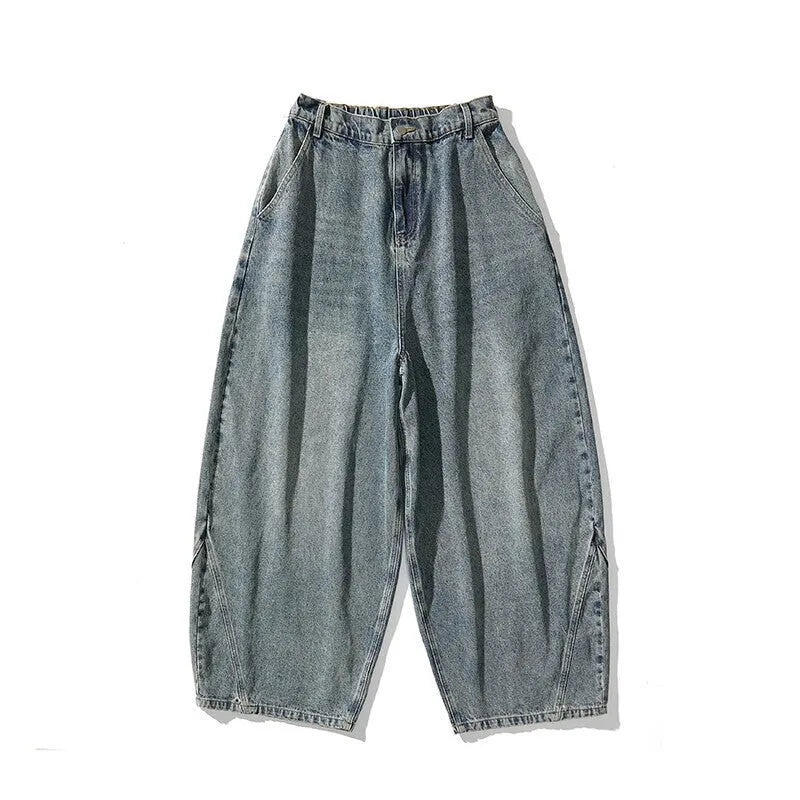 Men's plus size baggy blue jeans with wide straight legs on a hanger.