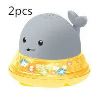 Automatic electric whale bath toy spraying water with flashing coloured lights