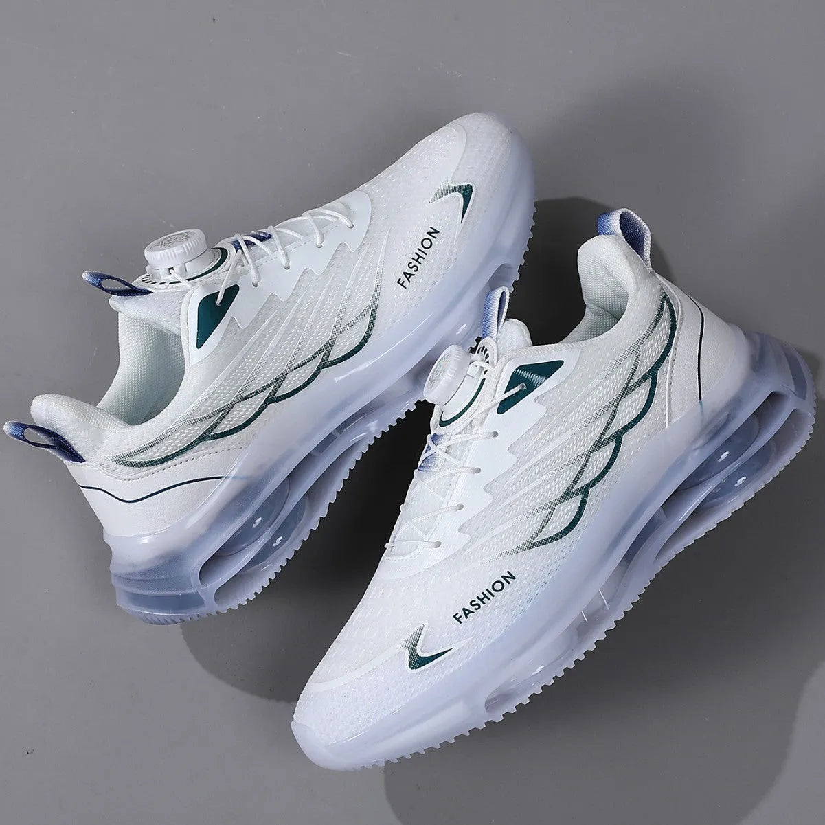 White low-top casual sports shoes with rotating button lace-up and mesh upper on a rubber sole.