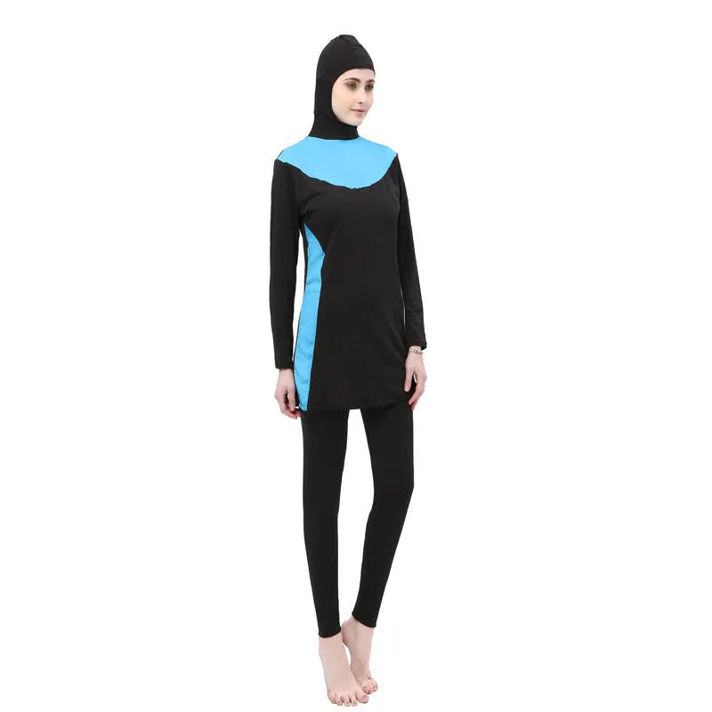 Conservative women's swimsuit with long sleeves and hood in black with coloured accents