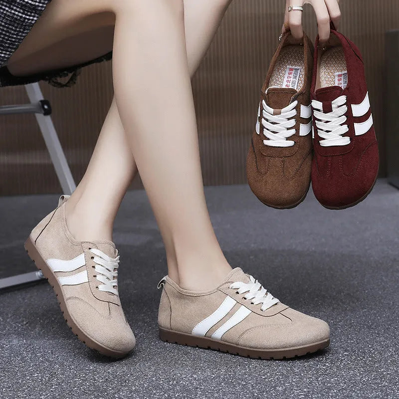 Women's vintage canvas sneakers in dark red with flat heel and round toe design