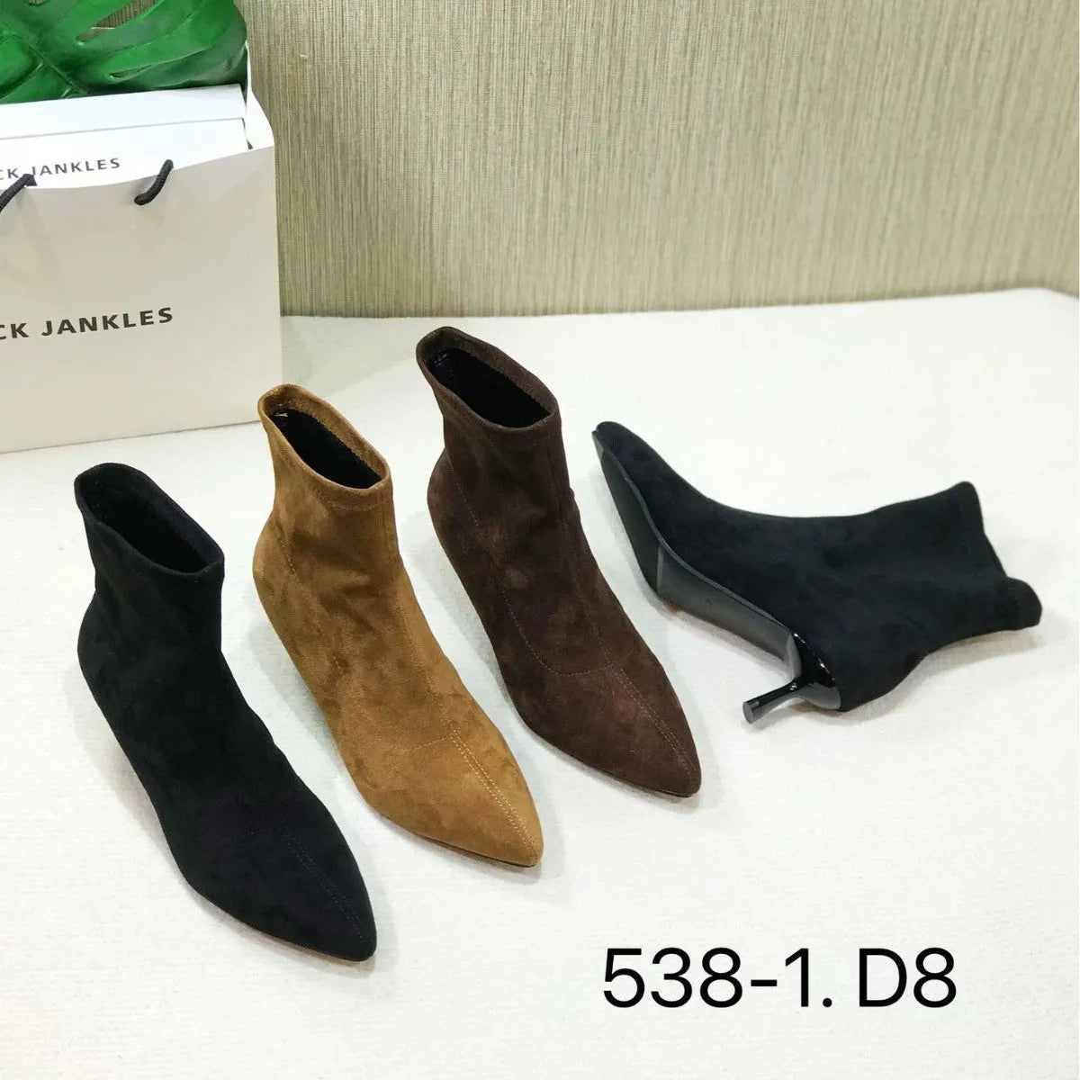 Women's black ankle boots with pointed toe and stiletto heel, mid-calf length