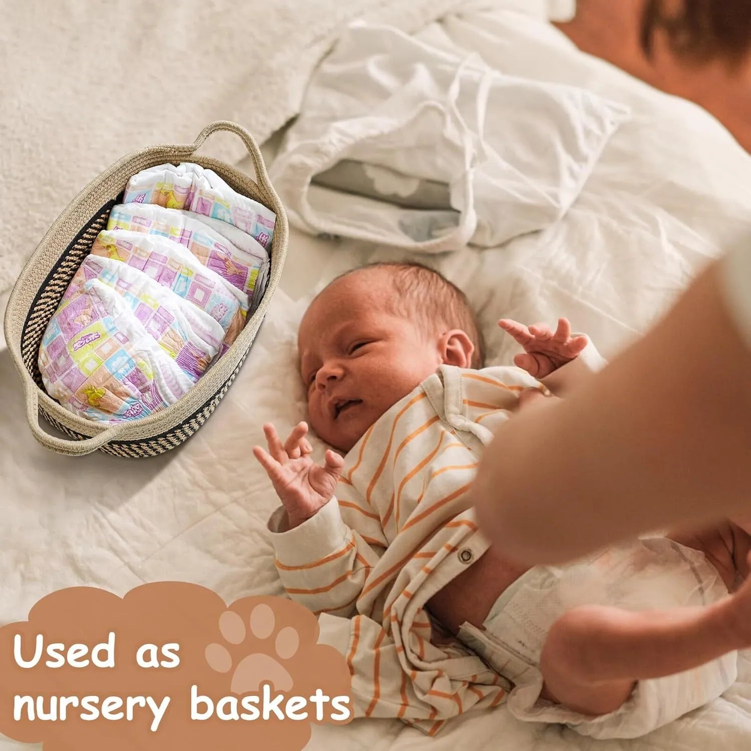 Light beige handmade woven cotton rope storage basket with wooden handle on a table.
