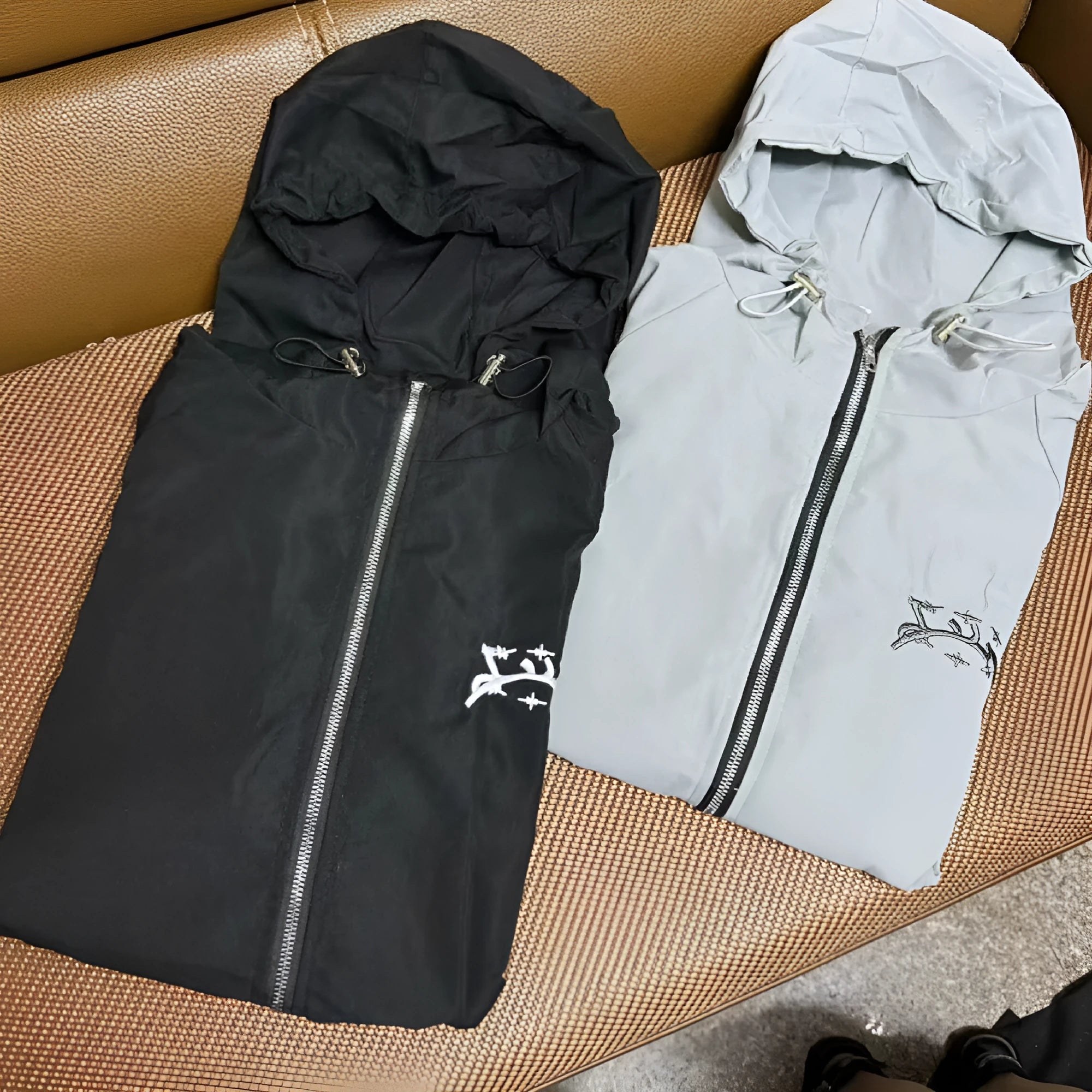 Men's grey hooded sunscreen jacket with loose British style fit on a middle-aged model