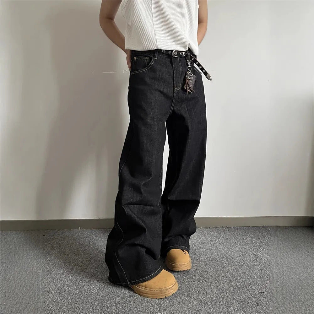Black loose wide-leg retro jeans with a straight-leg cut and zip fly on a model.