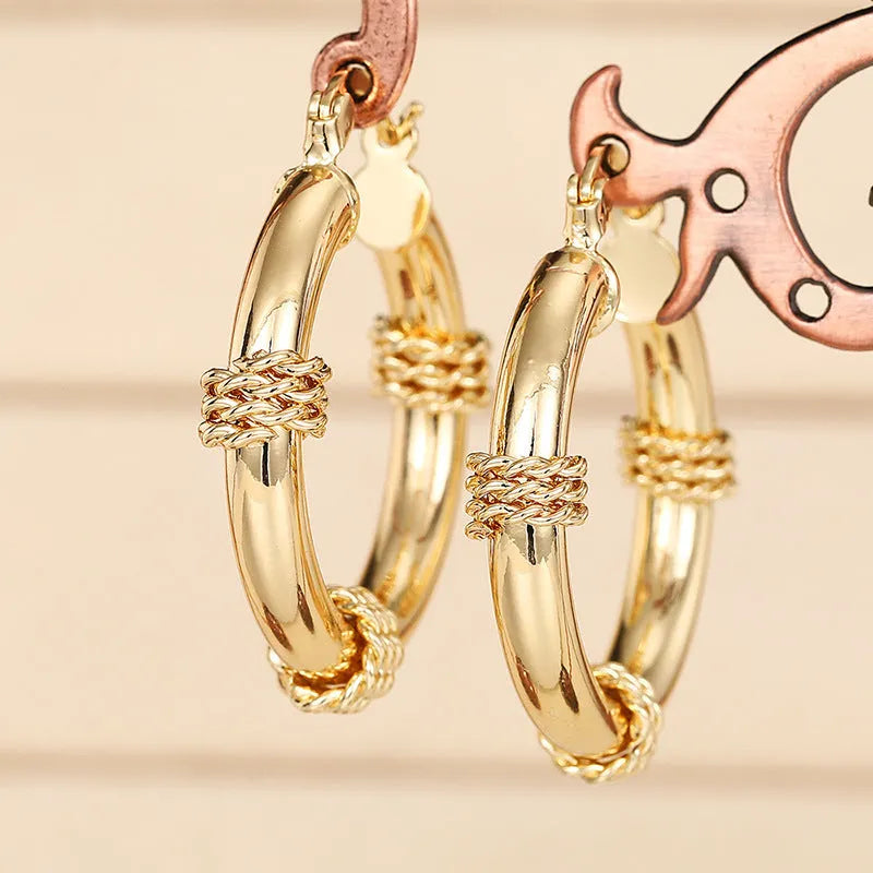 Geometric copper ring ear clips for women in golden colour with linear design elements