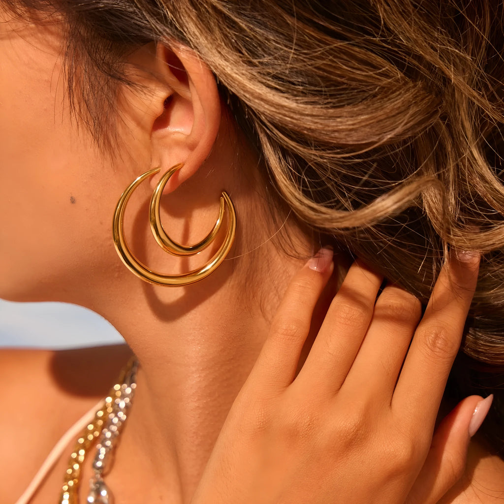 Geometric round hoop earrings in gold and steel finishes available in large and small sizes